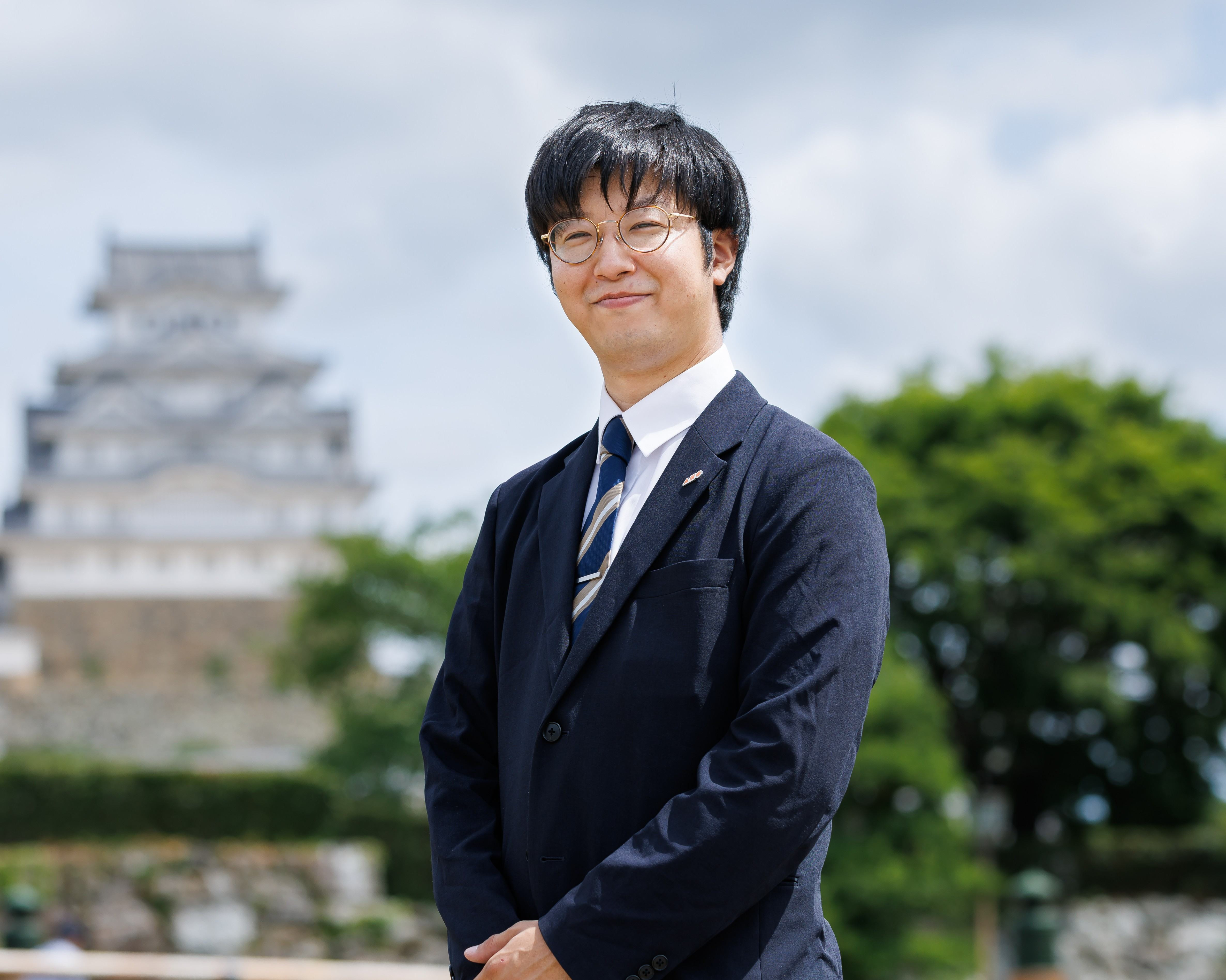 川口 佳文